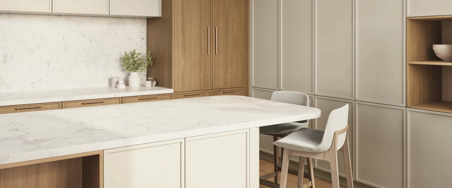 Natural wood and neutral kitchen cabinetry with a sculptural curved island