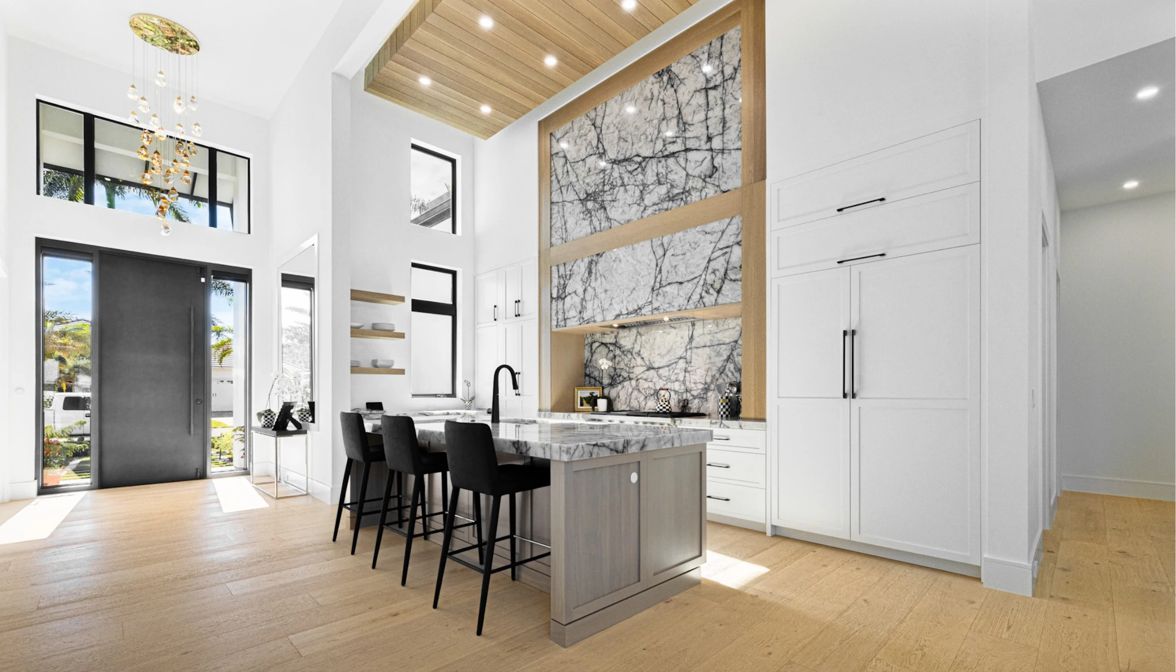 White kitchen with grey island, dramatic stone backsplash and timber ceiling