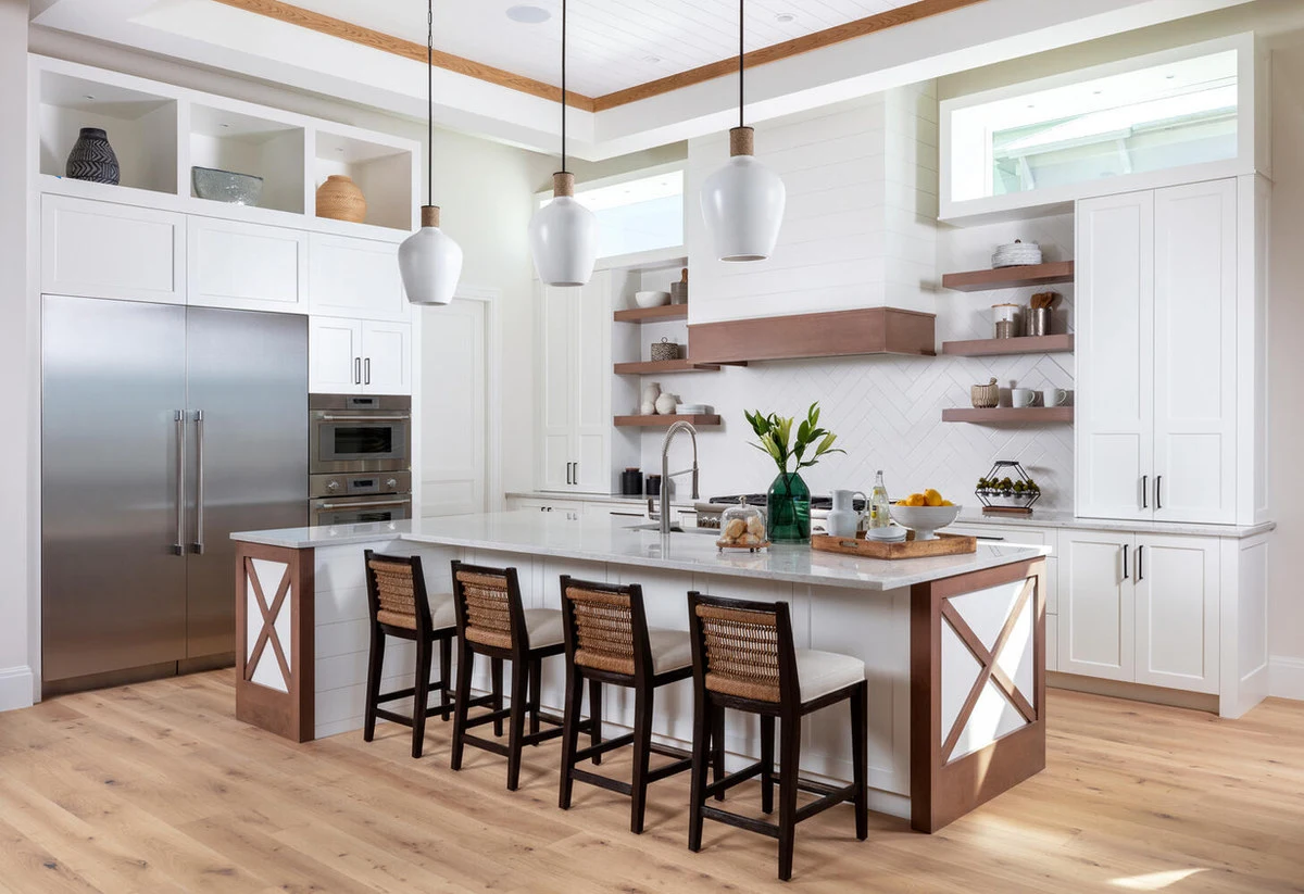 White kitchen cabinetry with a contrasting wood island, from DI’s published gallery