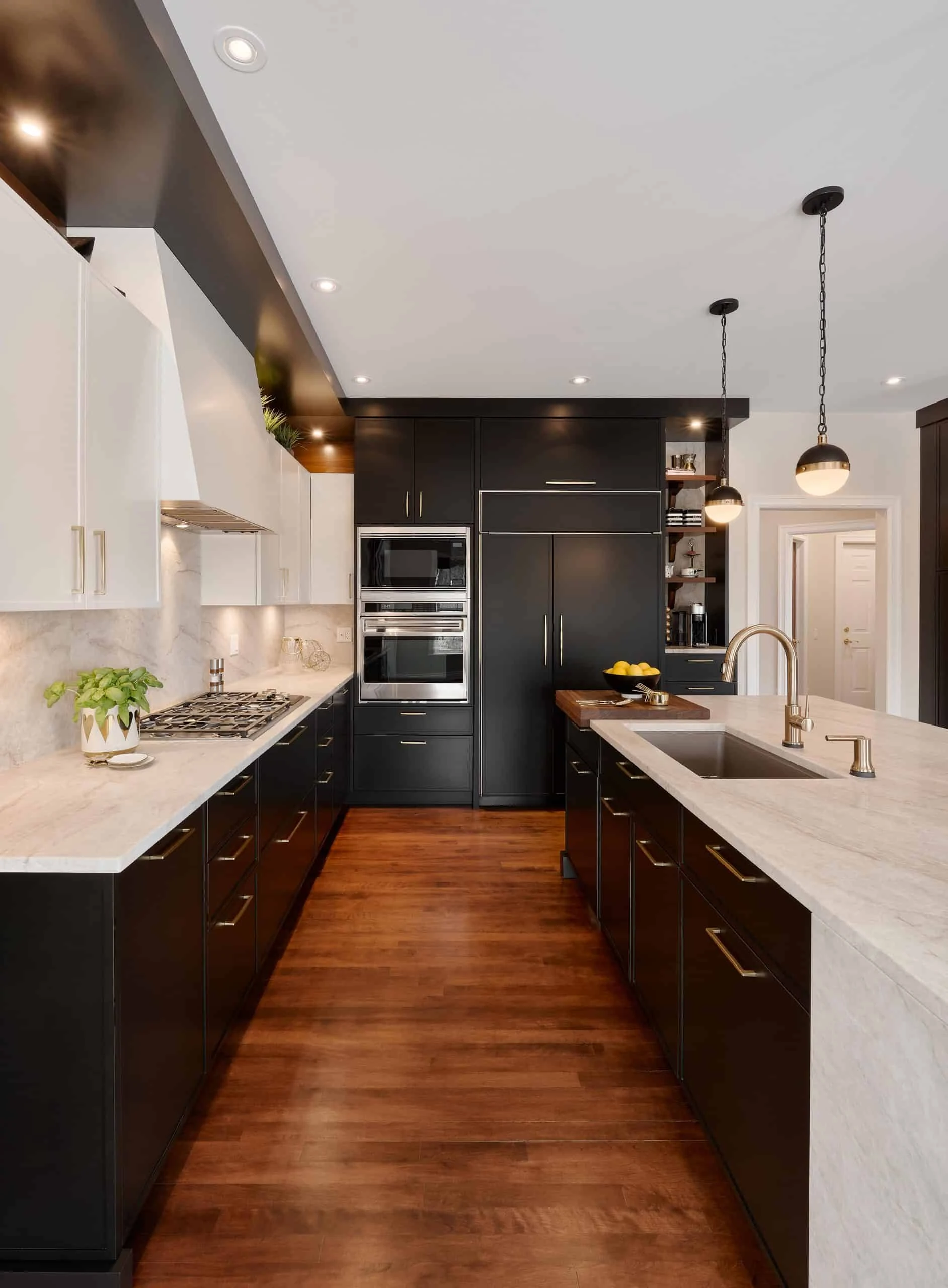 Elmwood cabinetry with natural wood grain and a stone-topped island